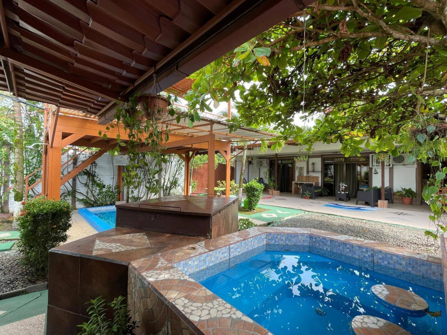 Villas Ela: mosaic-edged pool in the courtyard, among plants