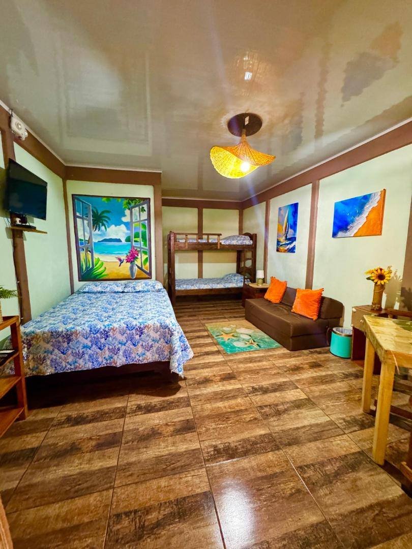 Villas Ela: bedroom with a bed and a sofa